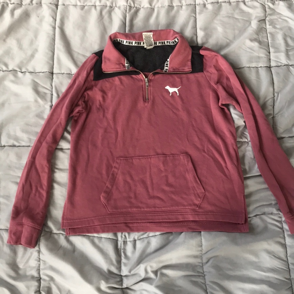 A pink quarter zip up